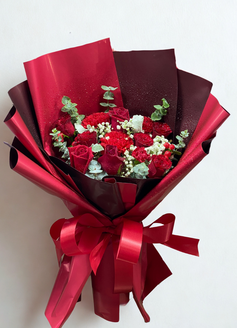 Luxury burgundy roses and red carnations bouquet with baby's breath wrapped in burgundy gradient paper - elegant flower delivery Bangkok | DP FLOWERS BANGKOK