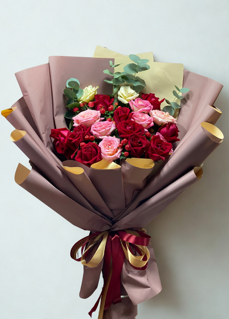 Luxury burgundy roses and pink roses bouquet with red berries wrapped in chocolate brown paper with gold accents - premium flower delivery Bangkok | DP FLOWERS BANGKOK