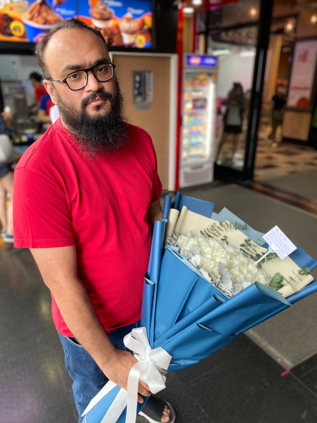 Happy man holding a beautiful bouquet from DP FLOWERS BANGKOK – real customer review, surprised with flower delivery
