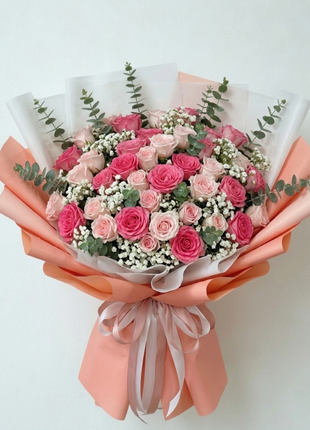 Elegant coral and pink roses bouquet with eucalyptus in white coral wrapping - fresh flower delivery Bangkok Grand Size | DP FLOWERS BANGKOK