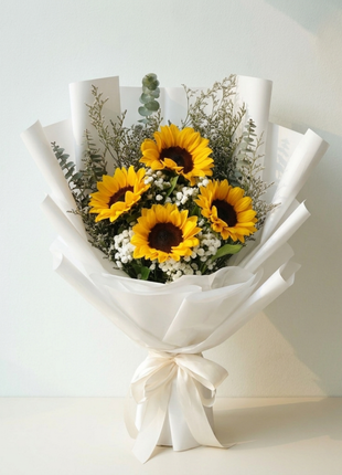 Fresh sunflower bouquet with baby's breath and eucalyptus in white wrapping - cheerful flower delivery Bangkok Deluxe Size | DP FLOWERS BANGKOK