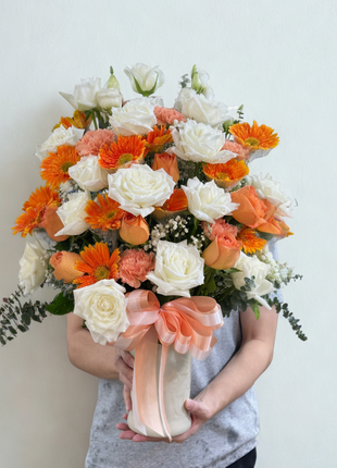 Elegant mixed flower vase arrangement with white roses, orange gerberas, peach carnations and eucalyptus - flower delivery Bangkok | DP FLOWERS BANGKOK