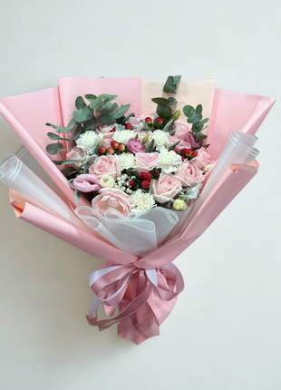 Elegant pink roses white carnations and red hypericum berries bouquet with eucalyptus in pink white wrapping - luxury flower delivery Bangkok | DP FLOWERS BANGKOK