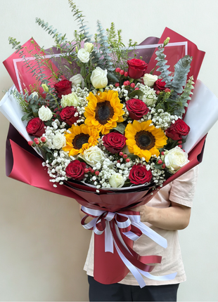 Grand sunflower and red roses bouquet with baby's breath wrapped in crimson paper with satin ribbon - flower delivery Bangkok | DP FLOWERS BANGKOK