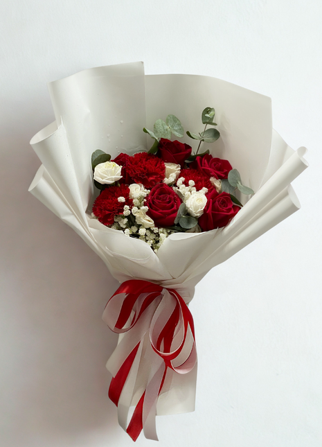 Classic red roses and white roses bouquet with burgundy carnations wrapped in white paper with red ribbon - romantic flower delivery Bangkok | DP FLOWERS BANGKOK