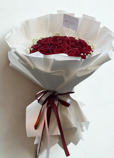 Grand bouquet of 30 premium deep red roses with baby's breath wrapped in white paper with burgundy satin ribbon - romantic flower delivery Bangkok | DP FLOWERS BANGKOK
