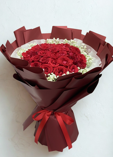 Spectacular bouquet of 30 premium red roses with baby's breath in deep red wrapping with red ribbon - grand Valentine's Day delivery Bangkok | DP FLOWERS BANGKOK