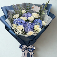 Elegant blue hydrangea and white roses bouquet with lavender wrapped in navy paper - luxury flower delivery Bangkok | DP FLOWERS BANGKOK