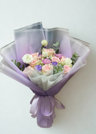 Enchanting mixed bouquet with peach roses, white roses and purple lisianthus wrapped in lavender gradient paper - dreamy flower delivery Bangkok | DP FLOWERS BANGKOK