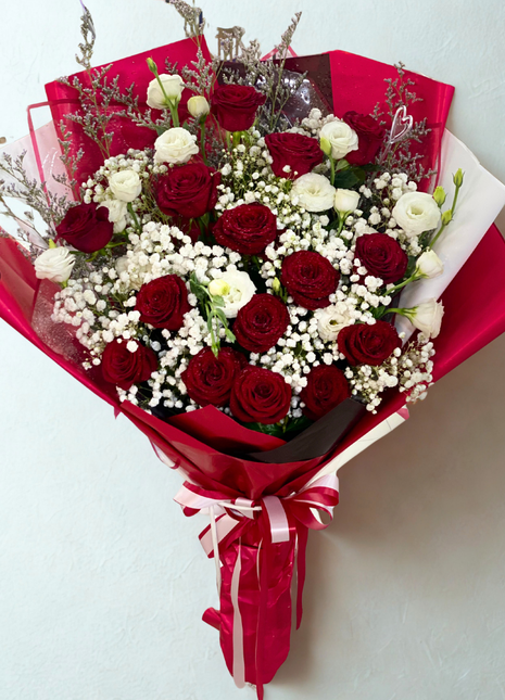 Luxury red roses and white lisianthus bouquet with baby's breath wrapped in deep red paper - romantic flower delivery Bangkok | DP FLOWERS BANGKOK