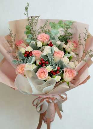 Natural garden bouquet with pink roses, white carnations, eucalyptus and red berries wrapped in blush pink paper - flower delivery Bangkok | DP FLOWERS BANGKOK