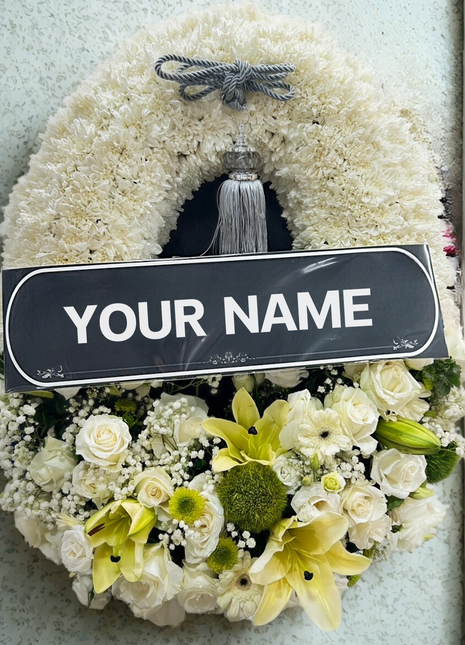 Premium condolence wreath with white chrysanthemums, roses, yellow lilies, and green accents — luxury funeral flower | DP FLOWERS BANGKOK