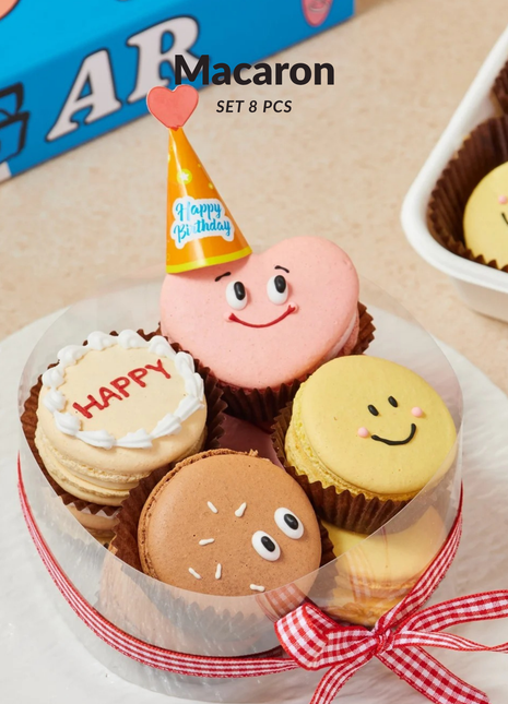 Adorable French macaron set with smiley faces. 8 premium macarons in gift box. Perfect add-on with flowers. Cute birthday treat. Order now!