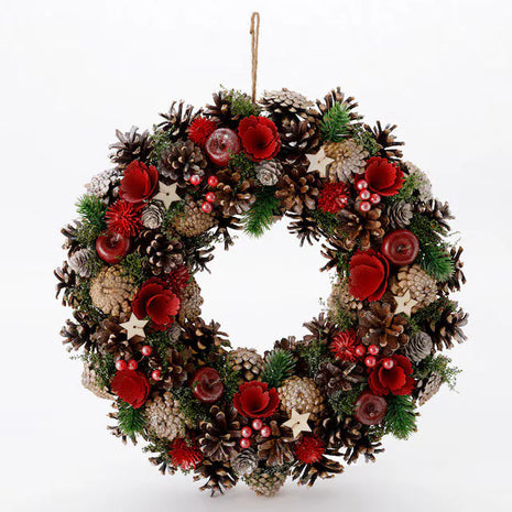 Luxurious large handcrafted Christmas wreath with abundant pine cones, red dried flowers, burgundy accents, evergreen sprigs and wooden stars with jute rope - grand holiday decoration Bangkok | DP FLOWERS BANGKOK