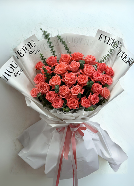 Coral roses bouquet wrapped in white paper - romantic flower delivery Bangkok | DP FLOWERS BANGKOK