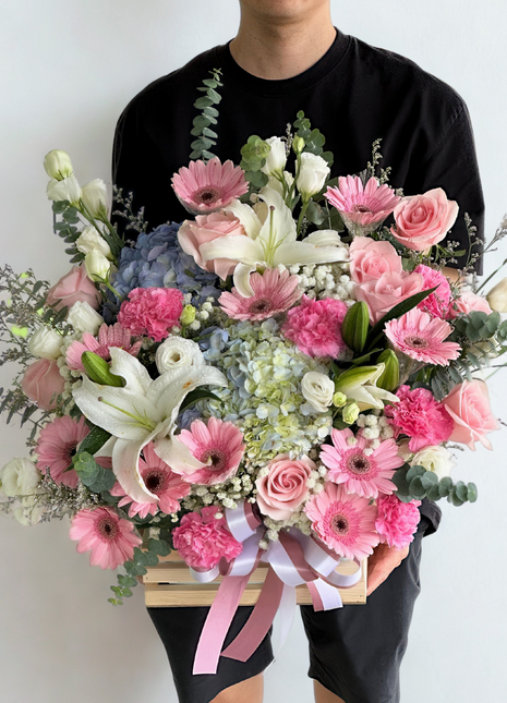 Grand luxury flower basket with white lilies, pink roses, gerberas, hydrangeas, and mixed premium flowers in wooden basket with ribbons - spectacular flower delivery Bangkok | DP FLOWERS BANGKOK