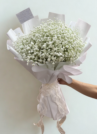Large full white baby's breath gypsophila cloud bouquet wrapped in pearl white paper with ivory organza ribbon - flower delivery Bangkok | DP FLOWERS BANGKOK