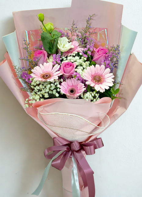 Mixed bouquet with pink gerberas, purple roses and lavender sprigs wrapped in pink paper - fresh flower delivery Bangkok | DP FLOWERS BANGKOK