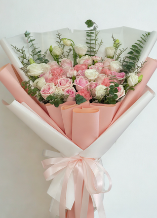 Elegant soft pink and white roses bouquet with carnations and lisianthus wrapped in double-layer pink and white paper with satin ribbons - luxury flower delivery Bangkok | DP FLOWERS BANGKOK