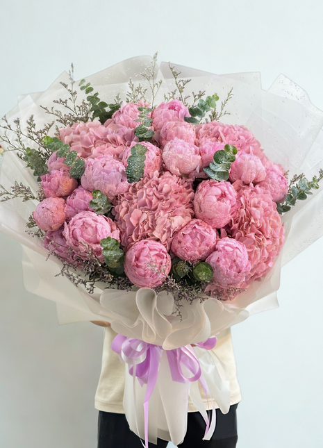 Luxury pink peony and hydrangea bouquet with eucalyptus wrapped in ivory paper with lavender ribbons - premium flower delivery Bangkok | DP FLOWERS BANGKOK