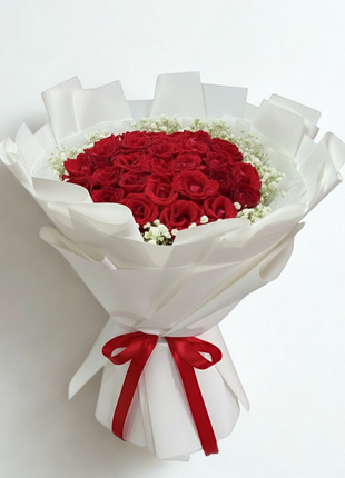Spectacular bouquet of 30 premium red roses with baby's breath in white wrapping with red ribbon - grand Valentine's Day delivery Bangkok | DP FLOWERS BANGKOK