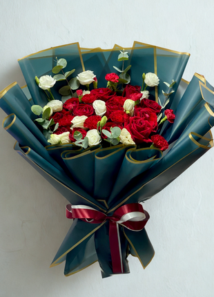 Luxury red and white roses bouquet wrapped in emerald green paper with gold trim and burgundy ribbon - romantic flower delivery Bangkok | DP FLOWERS BANGKOK
