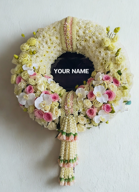 Luxury memorial wreath with pink roses, white orchids, yellow roses and traditional Thai jasmine garlands with pink accents - premium funeral flowers Bangkok | DP FLOWERS BANGKOK
