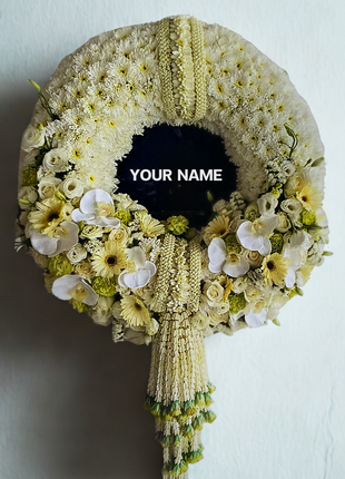 Luxury memorial wreath with white orchids, roses, golden chrysanthemums and traditional Thai jasmine garlands with floral tassels - premium funeral flowers Bangkok | DP FLOWERS BANGKOK