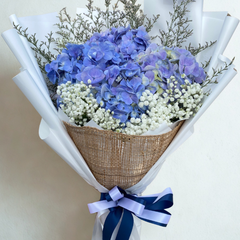 Blue hydrangea bouquet with baby's breath and burlap wrapping in white paper with navy ribbon - rustic flower delivery Bangkok | DP FLOWERS BANGKOK