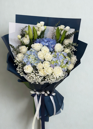 Elegant white roses and blue hydrangeas bouquet with lilies in navy white wrapping - premium flower delivery Bangkok | DP FLOWERS BANGKOK