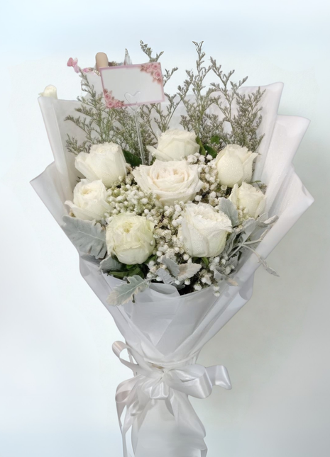Elegant white roses bouquet with baby's breath and dusty miller wrapped in white paper - classic flower delivery Bangkok | DP FLOWERS BANGKOK