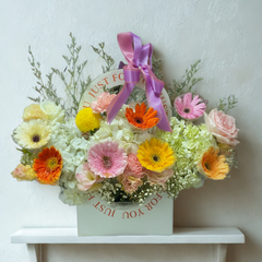 Colorful gerbera daisies and roses arrangement in decorative gift box with purple ribbon - flower delivery Bangkok | DP FLOWERS BANGKOK