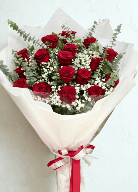 ALT Text:
Classic red roses bouquet with baby's breath and eucalyptus wrapped in white paper - premium flower delivery Bangkok | DP FLOWERS BANGKOK