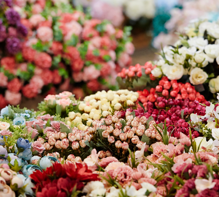Colorful fresh flowers arranged like a flower shop – DP FLOWERS BANGKOK FAQ page background image.