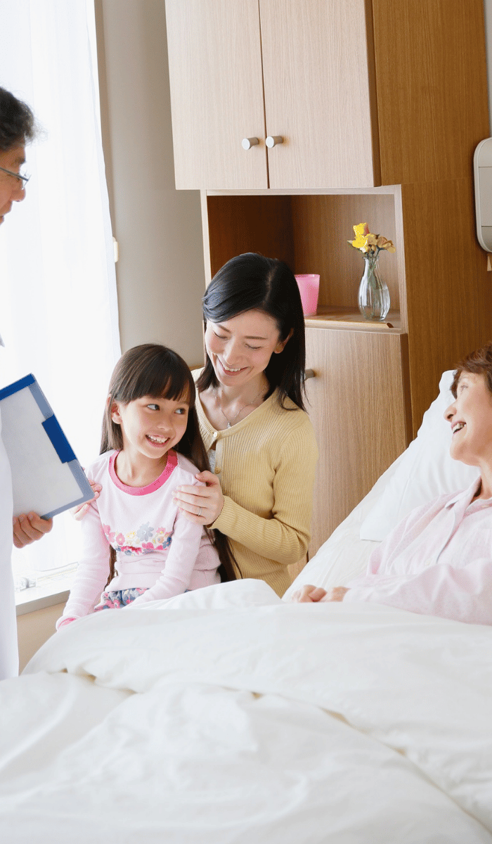 Doctor and family visiting patient in hospital – DP FLOWERS BANGKOK get well soon flower delivery service